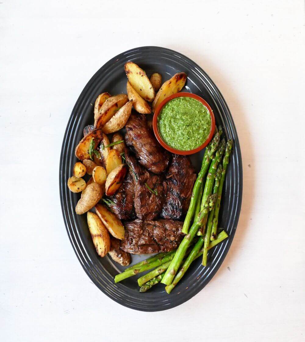 Flank Steaks Marinated in Balsamic Vinegar with Arugula Pesto